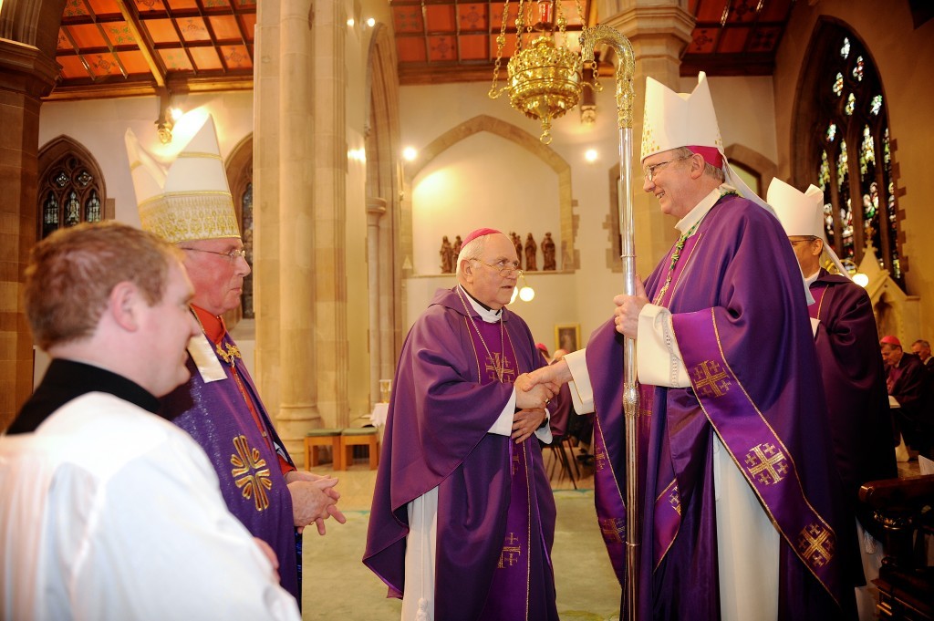 Old meets new.... Bishop McKeown is congratulated by his predecessor Bishop Seamus Hegarty.