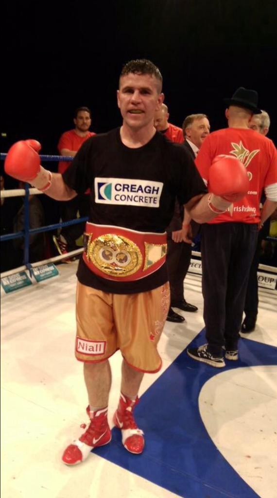 Eamonn O'Kane proudly shows off his IBF title which he retained on a points decision at Lavey's GAC last night