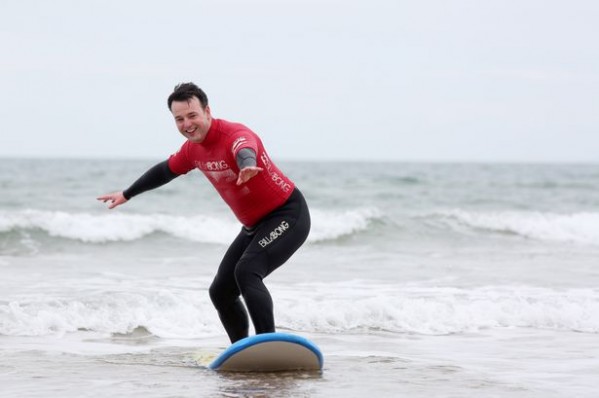 ALL A-BOARD...SDLP leader Colum Eastwood tries his hand at surfing